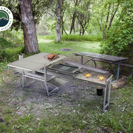 Camping kitchen with dining table set for outdoor use with stainless kitchen grill by overland vehicle system